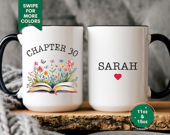 May include: Two white ceramic mugs with black handles and black rims. The mug on the left has a floral design with an open book and the text "CHAPTER 30". The mug on the right has the text "SARAH" with a red heart. Both mugs are 11oz and 15oz.