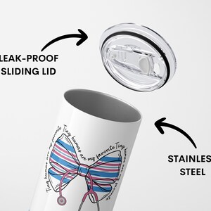 May include: White stainless steel tumbler with a pink and blue striped bow and stethoscope design. The tumbler has a leak-proof sliding lid. The text on the tumbler reads "Tiny humans are my favorite Tiny humans are my favorite".