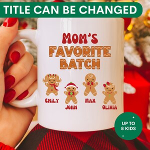 May include: White ceramic mug with a gingerbread person design and the text "Mom's Favorite Batch". The mug has four gingerbread people with names "Emily", "John", "Max", and "Olivia". The text "Up to 8 Kids" is in a green circle.