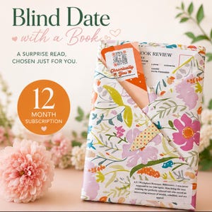 May include: A book wrapped in white paper with a colourful floral pattern of pink, orange, and green leaves. The package includes a bookmark with a QR code, a book review card, and a label with text about a workplace romance.