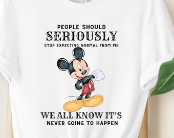 May include: White t-shirt with a black and white illustration of Mickey Mouse. The text on the shirt reads "People should seriously stop expecting normal from me. We all know it's never going to happen."