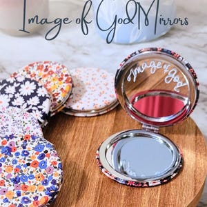 May include: A set of three ceramic mugs with a speckled, matte finish. Each mug features a different color: light blue, cream, and gray. The mugs have a simple, modern design and a comfortable handle.