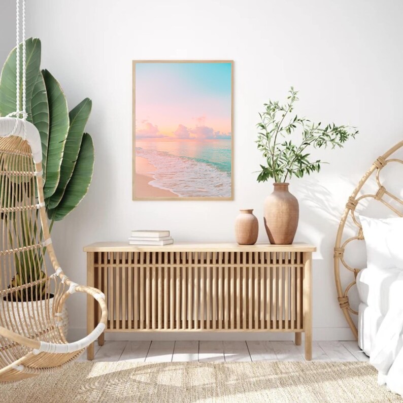 Tranquil coastal print set featuring soft pastel sunset hues over the ocean, elegant pink and teal wall art for modern beach house decor.