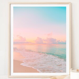 Coastal wall art set showcasing serene sunrise and sunset scenes in blush and turquoise tones, ideal for beach cottage or living room decor.