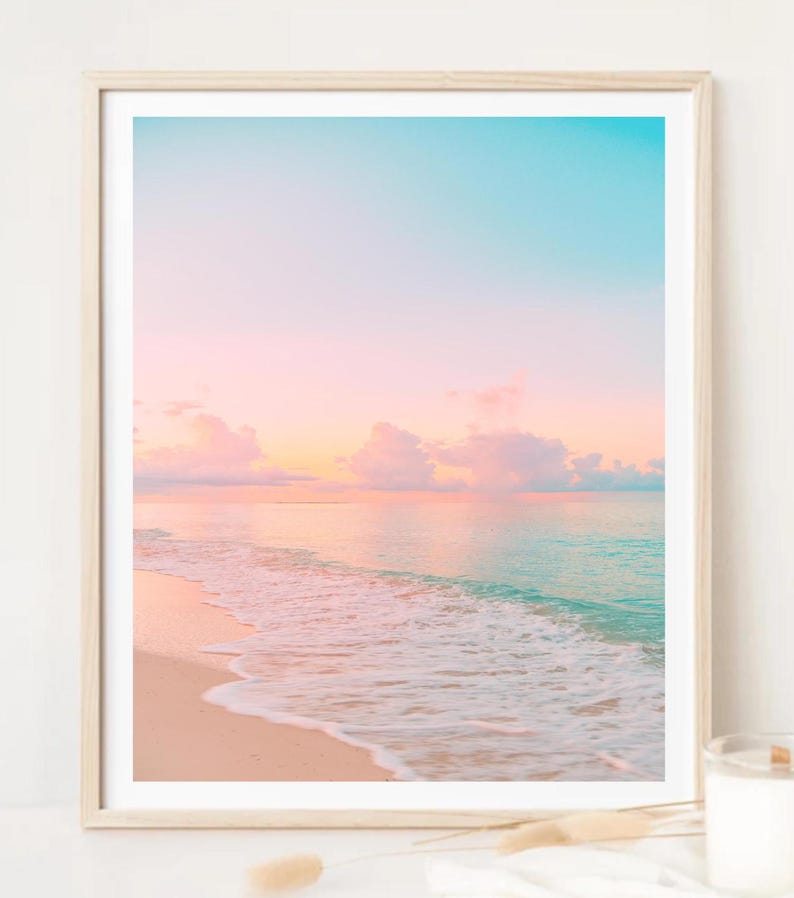 Coastal wall art set showcasing serene sunrise and sunset scenes in blush and turquoise tones, ideal for beach cottage or living room decor.