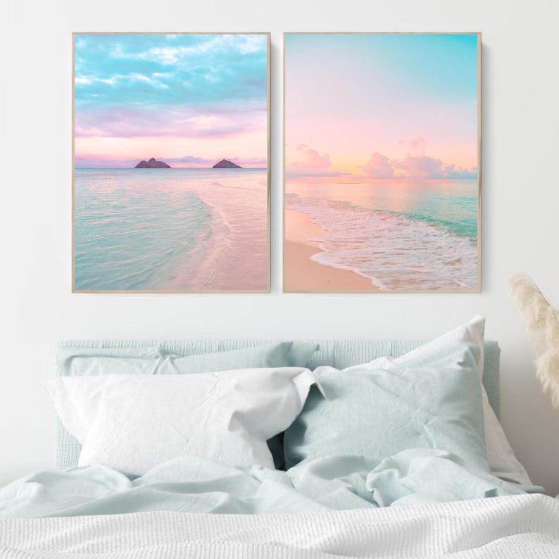 Pastel beach sunset print set featuring soft pink and teal tones, depicting a tranquil coastal scene with gentle waves and a calming sunrise/sunset glow. Ideal coastal wall art for a living room, beach cottage, or above-bed decor, creating a peaceful and airy atmosphere.