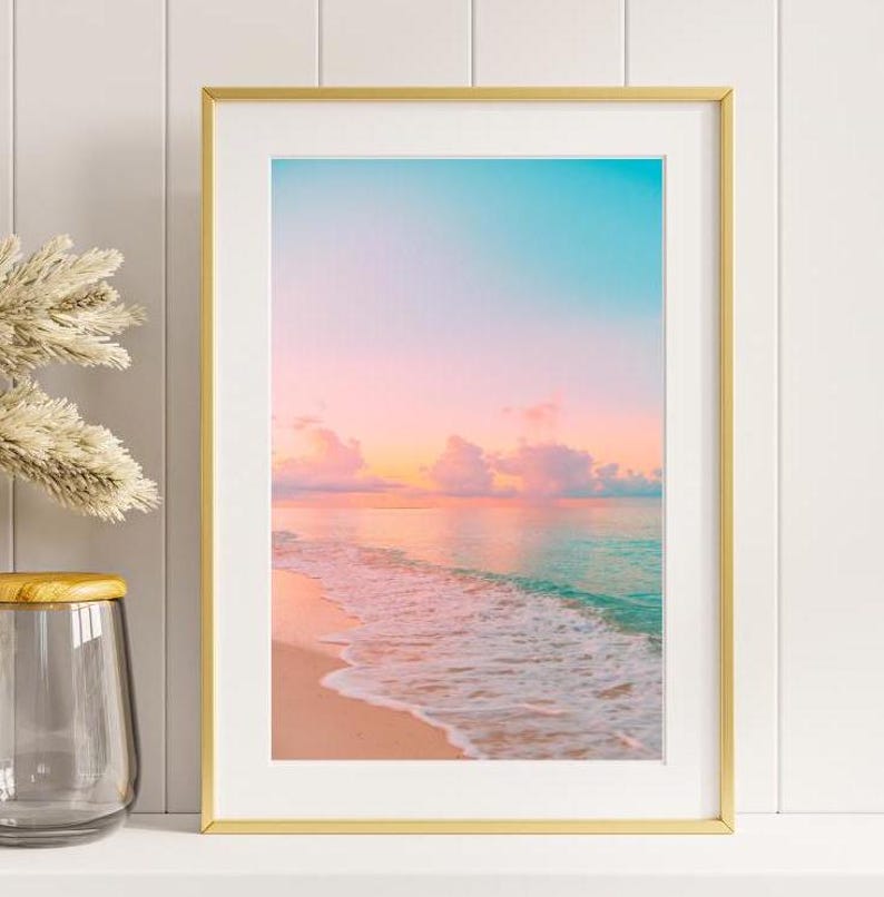 Pastel ocean sunset artwork capturing a quiet shoreline and tranquil sea at dusk.