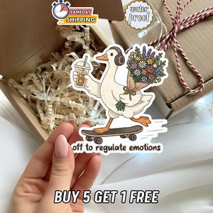 May include: A sticker featuring a cartoon goose on a skateboard, holding a coffee and flowers, with the text "off to regulate emotions." The sticker is waterproof and has a "Sameday Shipping" label.
