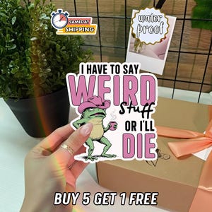 May include: A sticker with the text "I HAVE TO SAY WEIRD STUFF OR I'LL DIE" featuring a cartoon frog wearing a pink cowboy hat and holding a coffee cup. The sticker is waterproof.