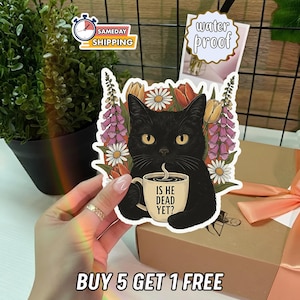 May include: A black cat sticker with yellow eyes, holding a coffee mug that reads "IS HE DEAD YET?" surrounded by flowers. The sticker is waterproof.