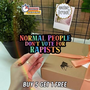 May include: A colorful sticker with the text "NORMAL PEOPLE DON'T VOTE FOR RAPISTS" is displayed. The image also includes a gift box with a bow, a plant, and a "waterproof" sticker. The text "BUY 5 GET 1 FREE" is also visible.