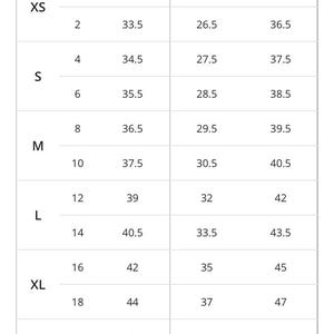 May include: A size chart for women's dresses with measurements in inches for bust, waist, and hip. The chart includes sizes XS, S, M, L, XL, XXL.