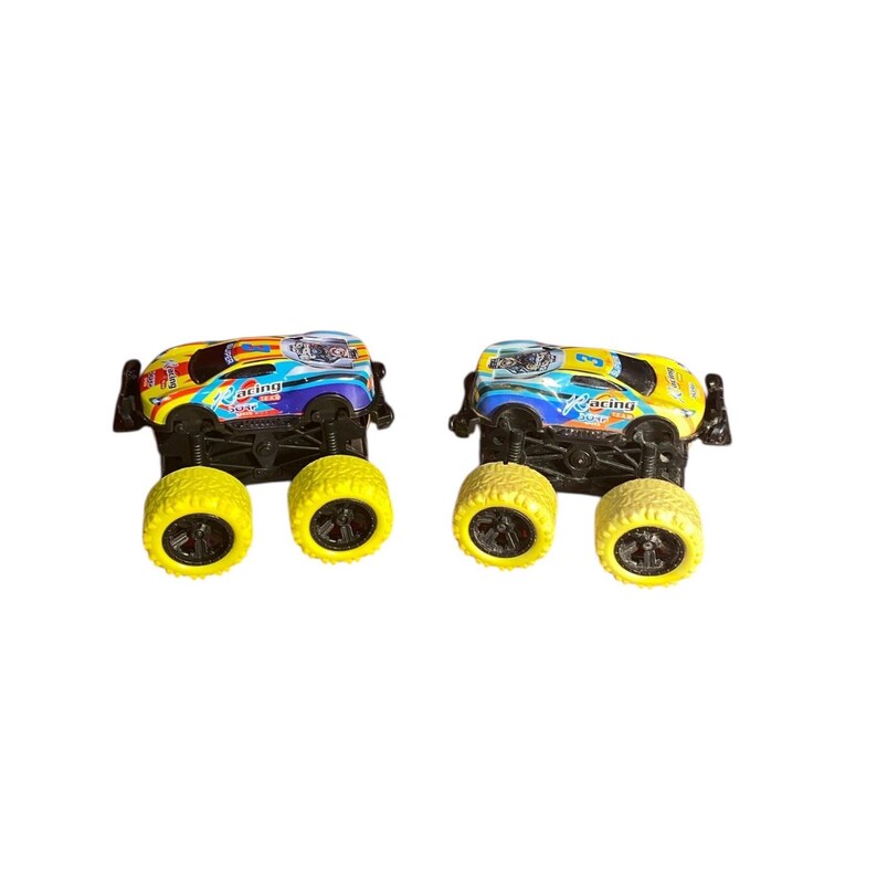 May include: Two toy monster trucks with yellow wheels and colorful designs. The trucks have a yellow, blue, and red color scheme with the word "Racing" printed on the side. The wheels are large and yellow with black centers.