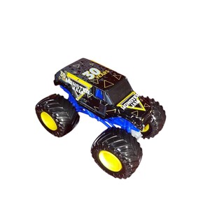 May include: A black and blue Monster Jam truck toy with yellow accents. The truck has large black tires with yellow rims and the text "30 YEARS" and "MONSTER JAM" on the body.