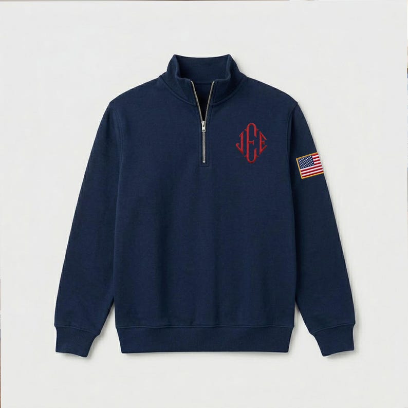 Navy blue quarter zip sweatshirt featuring a custom embroidered J.E.E monogram on the chest and a USA flag patch on the sleeve. Minimalist half zip pullover with a cozy fleece feel, relaxed fit, and classic preppy style, perfect for casual wear or personalized gifting.