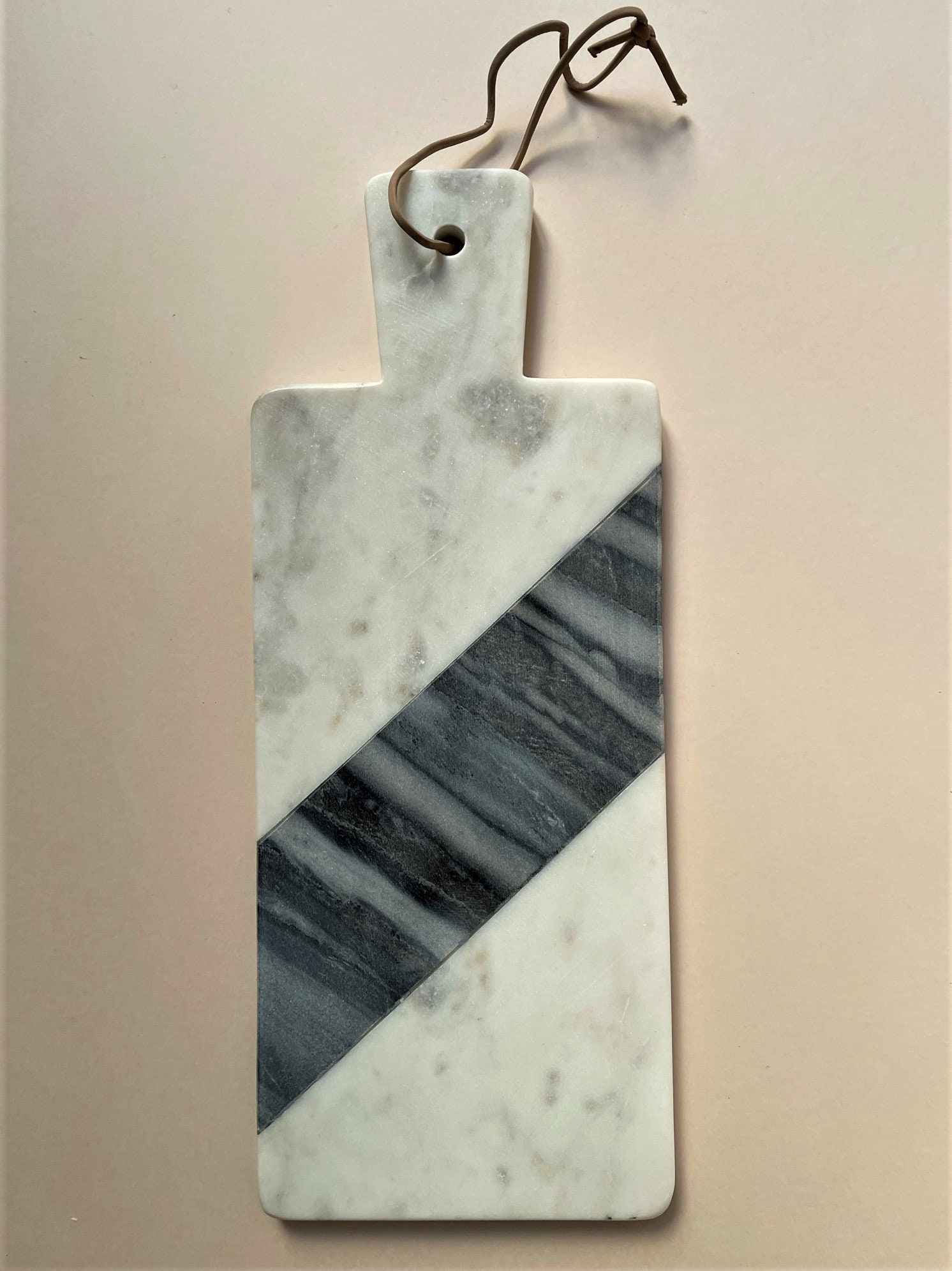 White and Grey Marble Chopping Board With Handle and Leather Cord