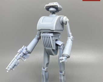 May include: A gray 3D printed robot action figure with a gun in its right hand. The robot has a large head with a dome-shaped top and a rectangular body. The robot's legs are long and slender, and its feet are flat.
