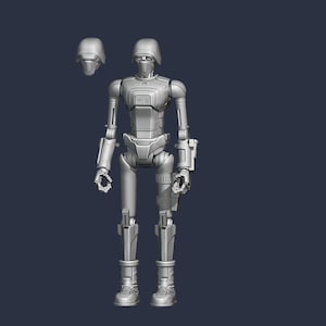 May include: A gray, unpainted 3D-printed action figure of a humanoid robot with a slender frame, articulated joints, and a helmeted head. A separate, detached helmet is positioned to the upper left of the main robot figure, which stands upright.