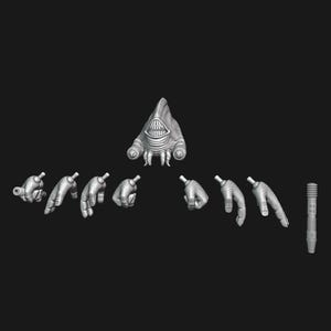 May include: A collection of gray 3D-printed objects against a black background. The objects include a creature head with a toothy grin, several disembodied hands in various poses, and a cylindrical object with a ridged surface.