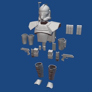 May include: A white plastic model kit of a Star Wars clone trooper, disassembled into its various parts. The kit includes the helmet, torso, arms, legs, and weapons.