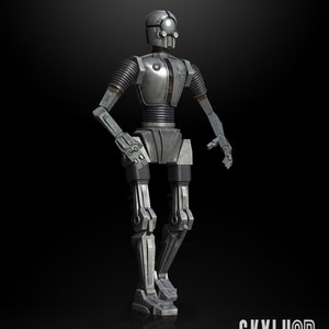 May include: A silver-colored robot with a detailed design, standing on a black background. The robot has a round head with two large eyes and a small mouth. The robot's arms and legs are articulated and have a mechanical look. The text "GE3 PROTOCOL DROID 1:12 SCALE STL READY" is at the bottom of the image.
