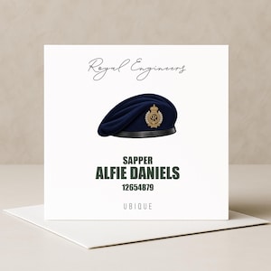 May include: A square greeting card featuring a dark blue beret with a gold Royal Engineers badge. Text reads Royal Engineers, SAPPER ALFIE DANIELS, 12654879, and UBIQUE. The design is centred on a white background with a matching white envelope below.