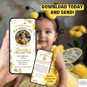 The image is a digital invitation for a baby's first bee-themed birthday party, featuring a young child dressed as a bee and a smartphone displaying the invitation.