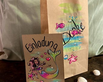 Mermaid-themed children's birthday party invitation in A6 format with rainbow-colored envelope and matching party favor bags.
