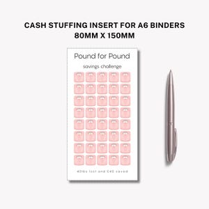 May include: A cash stuffing insert for A6 binders. The insert features a pink savings challenge with scale graphics. The text reads "Pound for Pound savings challenge" and "40lbs lost and £40 saved". A silver pen is to the right. The insert measures 80mm x 150mm.