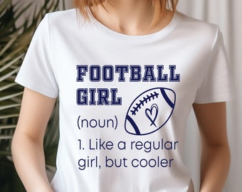 May include: White t-shirt with a blue graphic that says "FOOTBALL GIRL (noun) 1. Like a regular girl, but cooler" and a football with a heart on it.