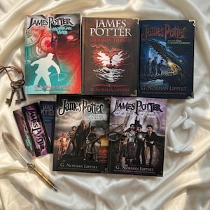May include: A collection of five James Potter books by G. Norman Lippert, including The Morrigan Web, Crimson Thread, The Hall of Elders Crossing, The Curse of the Gatekeeper, and The Vault of Destinies, with metal keys, a quill, and round glasses.