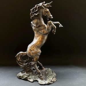The Noble Bucking Horse on a Roll Statue