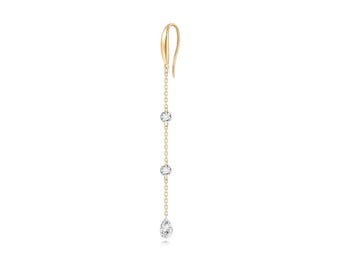 May include: A gold dangle earring with a pear-shaped diamond and two round diamonds.