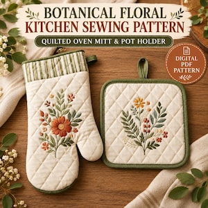 May include: A quilted oven mitt and square pot holder set featuring embroidered botanical floral designs in orange, yellow, and green. The items have cream-colored fabric with green striped trim and text reading BOTANICAL FLORAL KITCHEN SEWING PATTERN.