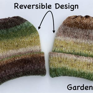 May include: Two reversible knit beanies with a color gradient of brown, green, and tan. The text "Reversible Design" and "Gardener" are displayed. The beanies are folded at the brim.