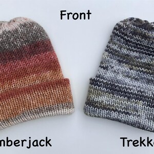 May include: Two knitted beanies. The "Lumberjack" beanie features a gradient of colors from brown to red. The "Trekker" beanie is gray, black, and green. The word "Front" is above the beanies. The word "Lumberjack" is below the first beanie. The word "Trekker" is below the second beanie.