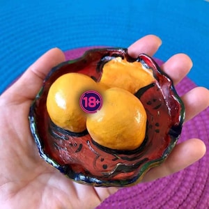 Female butt with an open rear, handcrafted from clay