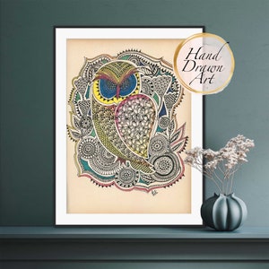 May include: A colorful hand-drawn illustration of an owl with intricate details. The owl is surrounded by a mandala-like design with swirls and patterns in shades of blue, green, yellow, pink, and black. The artwork is framed and labeled "Hand Drawn Art".