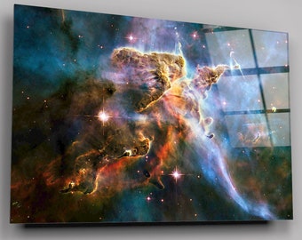 May include: A vibrant nebula with swirling colors of red, orange, yellow, blue, and purple. The nebula is filled with stars of various sizes and brightness. The image is a close-up of the nebula, showing its intricate details.
