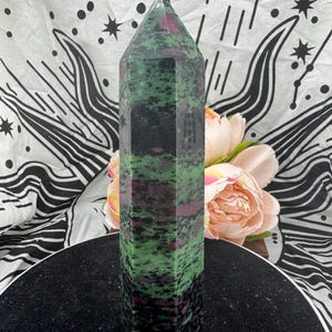 May include: A set of three ceramic mugs with a speckled, matte finish in cream, light grey, and dark grey. Each mug has a simple, minimalist design, suitable for coffee or tea.