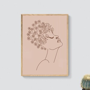 May include: A line drawing of a person's face with flowers growing out of their head. The drawing is in brown on a light pink background.
