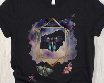 May include: Black t-shirt with a galaxy print and gold geometric frame featuring a blue and purple butterfly. Three smaller butterflies are also featured in the design.
