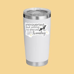 May include: White stainless steel tumbler with a sticker that reads "introverted but willing to discuss romantasy" with a dragon and a stack of books.