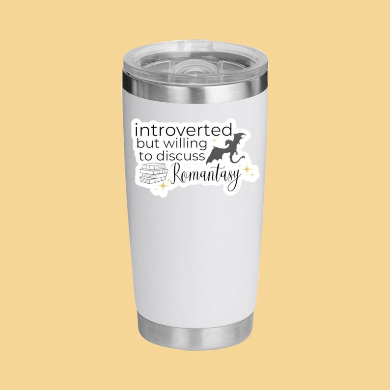 May include: White stainless steel tumbler with a sticker that reads "introverted but willing to discuss romantasy" with a dragon and a stack of books.