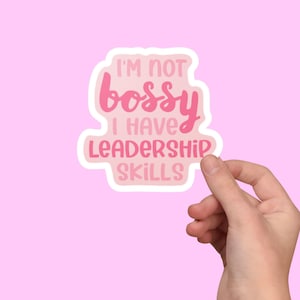 May include: Pink and white sticker with the text "I'm not bossy I have leadership skills".