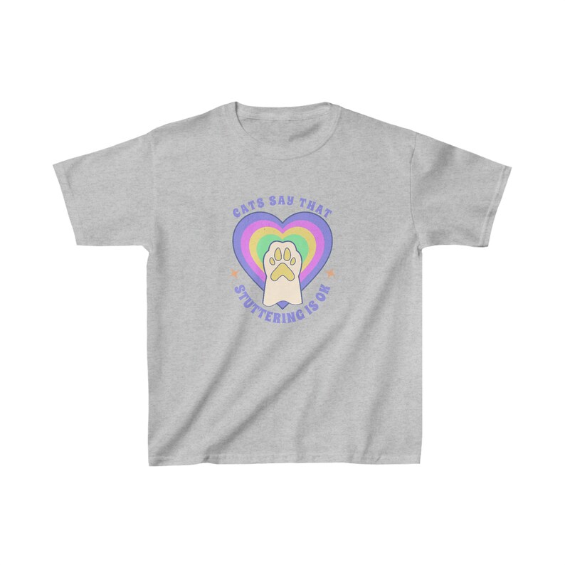 May include: A gray t-shirt with a rainbow heart and a paw print inside. The text "Cats say that stuttering is ok" is written around the heart.