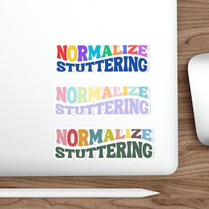 May include: Three colorful stickers with the words "NORMALIZE STUTTERING" in a retro font. The top sticker has red, yellow, purple, and blue text. The middle sticker has pink, green, and purple text. The bottom sticker has orange, yellow, and green text.