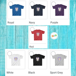May include: A set of youth t-shirts in various colors, featuring a heart with the text "Keep Kids Safe" and a rainbow design. The shirts are available in royal blue, navy blue, purple, red, white, black, and sport grey.
