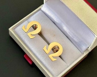 A premium set of gold plated cuff links omega in a premium box