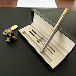 An amazing set of a premium silver plated - stainless steel ballpoint pen in a deluxe case